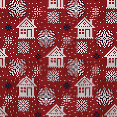 Knitted vector winter seamless decorative pattern, houses and snow.