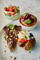 Delicious cupcakes with delicate caramel filling inside, decorated with fresh fruit.