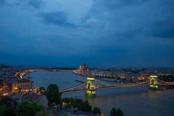 Fototapeta na wymiar cityscape view of Danube river at the night with bridge in Budapest