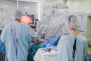 The process of carrying out a surgical operation using a modern robotic surgical system. Medical robot.