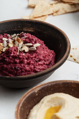 Beetroot hummus with walnuts, sunflower seeds and chickpeas hummus
