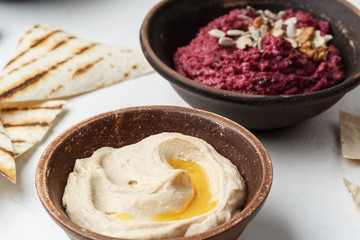Beetroot hummus with walnuts, sunflower seeds and chickpeas hummus