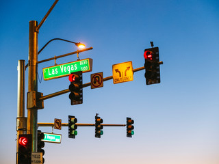 Traffic and traffic light signs in Las Vegas USA at sunset