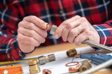 Plumber working on fittings