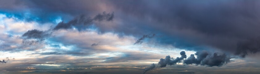 Naklejka na ściany i meble Fantastic dark blue thunderclouds at sunrise, natural composition