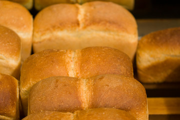 Bakery goods concept. Close up view of freshly baked bakery in hypermarket