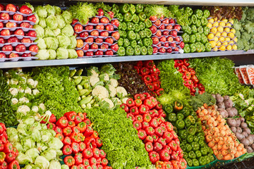 Many varieties of vegetables on the shelf in the supermarket