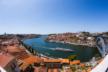 View over the city of Porto in Portugal, showing the rooftops and River Douro and The Dom Luís I Bridge