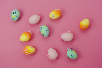 Top view shot of arrangement decoration Happy Easter holiday background concept.Flat lay colorful bunny eggs with accessory ornament on modern beautiful pink paper at office desk.Design pastel tone.