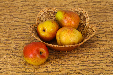 Pear heap in the wooden basket