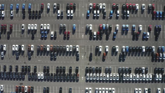 Aerial top view dealer car parking with lot of vehicle