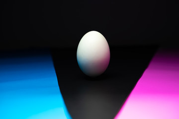 The eggs are in black, blue, pink background. Easter Egg Concept and Dark Concept