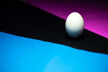 The eggs are in black, blue, pink background. Easter Egg Concept and Dark Concept