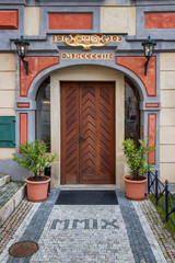 Fototapeta na wymiar wooden door of a historic burgher house in the center of Prague