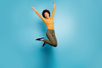 Full size photo of cheerful afro american girl win lottery jump raise fists scream yeah feel...