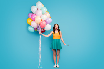 Full length photo of astonished girl celebrate her birthday with friends recieve dream present hold...