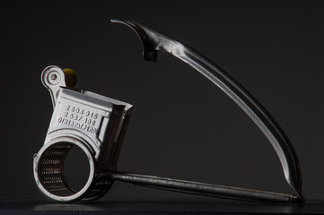 retro grater against grey background
