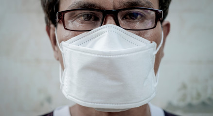 ase control, COVID-19 2019-novel coronavirus (2019-nCoV) virus infection spreading from Wuhan, China. Asian man wearing surgical mask as prevention at airport, banner 