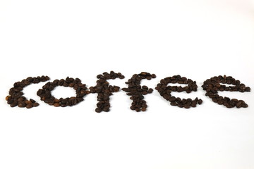 The coffee beans are arranged in alphabetical order and the coffee powder is on a white background.