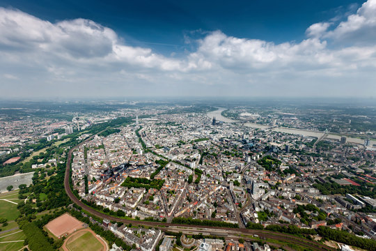 Aerial photo of Cologne Germany in summer with sun taken from a helicopter.