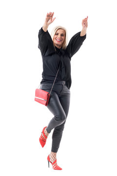 Cheerful Excited Joyful Middle Aged Well Dressed Woman Dancing With Outstretched Arms Reaching Up. Full Body Length Isolated On White Background.