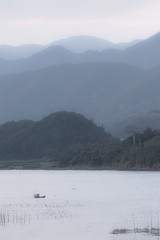 There is a small fishing boat in the seaside 