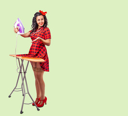 young woman ironing her dress. pin-up style