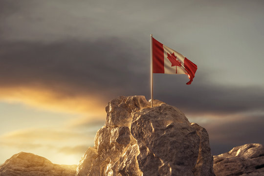 3d rendering of waving Canadian flag on rocky landscape in the evening sunlight