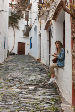 Woman doing turism in Cadaques, Catalonia, Spain.