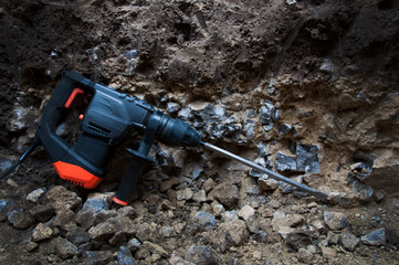 Power tools. Hammer drill. Breaks the rock