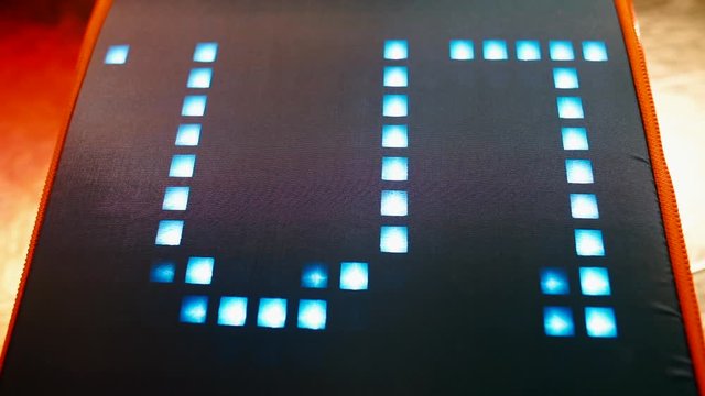 The word future is written on the big screen. The word is spelling from the side. The concept of evolution.