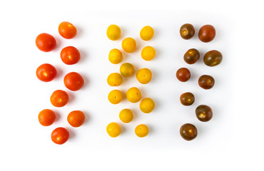 Varieties of cherry tomatoes in line isolated on white background, abstraction