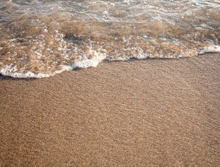 Close up sea water waves with bubbles