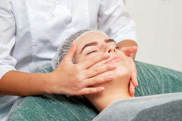 Fototapeta na wymiar Face massage of woman.