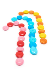 three colored candies isolated on white background vertical format