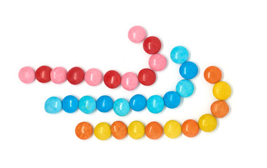 three colored candies isolated on white background