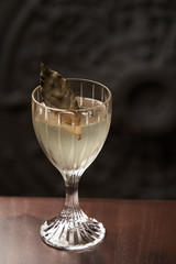 Classic cocktail glass on wood table in night club restaurant