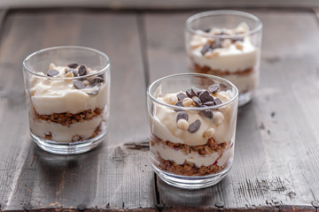 delicious layered dessert of muesli and fruit yogurt decorated with chocolate