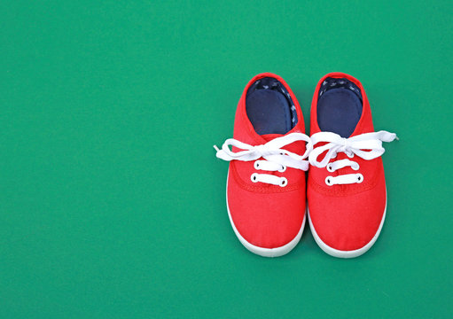 Redtextile Child's Shoes On Empty Space Background,kid's Footwear,baby Sneakers.