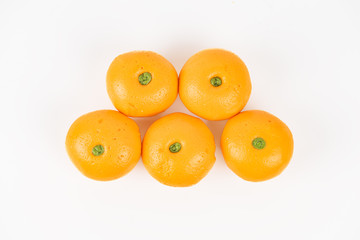 Pork dumpling in cartoon style,Pork bun like an orange in a white plate on the indoor dining table