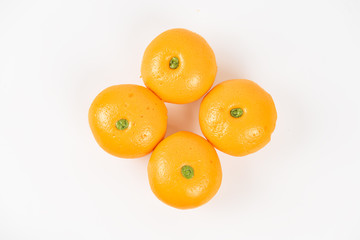 Pork dumpling in cartoon style,Pork bun like an orange in a white plate on the indoor dining table