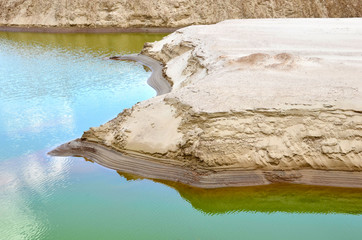 Sand and gravel washing production process in open-pit mining. Crushing the pebbles or ores,...