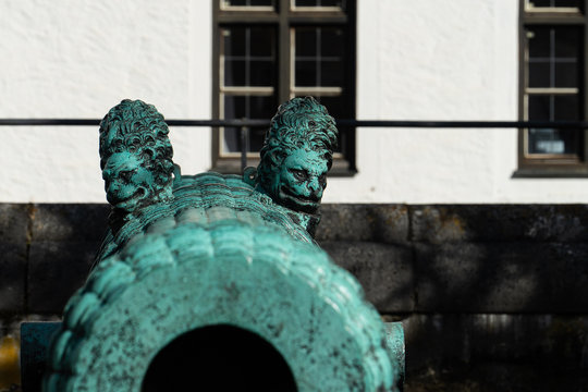 Blue old cannon with lion heads