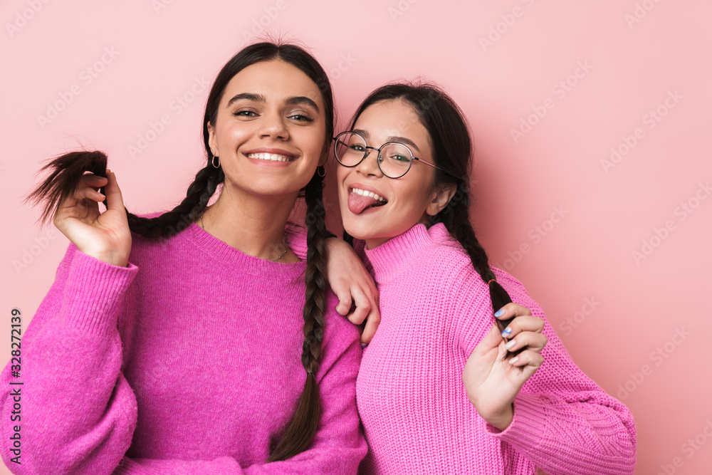 Sticker image of two happy teenage girls in casual clothes smiling at camera