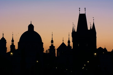Obraz premium Prague's skyline at sunrise, from Charles Bridge