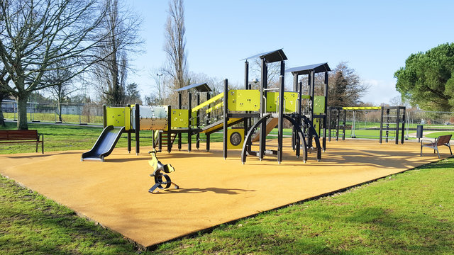 children yellow playground activities in public green park modern
