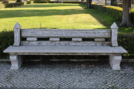 Bench Of White Marble Stone In The City Park In Portugal