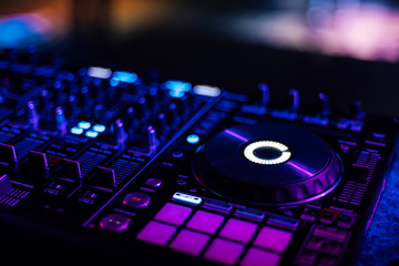 Fototapeta na wymiar DJ mixer controller Board for mixing music in a nightclub