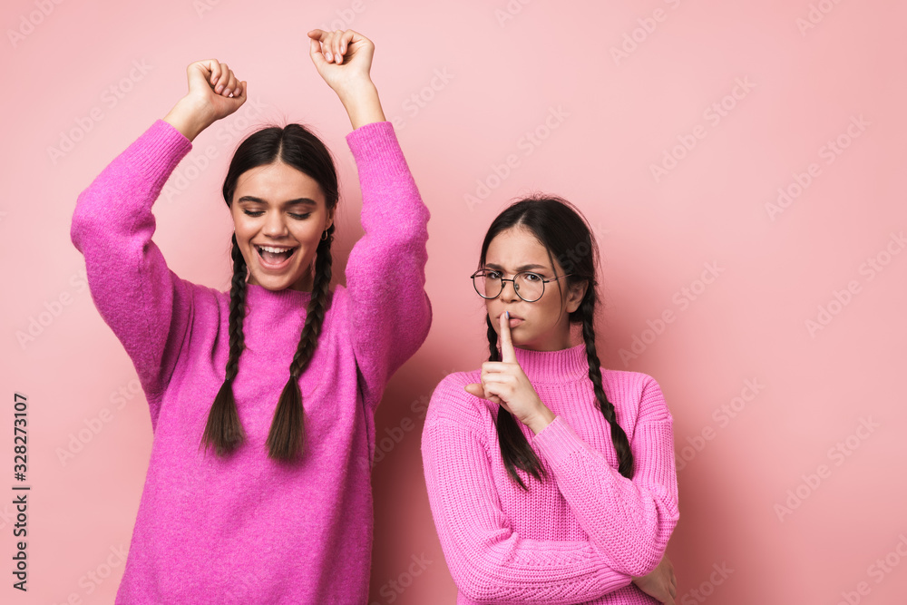 Sticker Image of young girl having fun while female friend asking her to be quiet