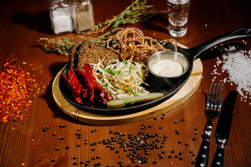 Selection of beer and snacks.Chips, fish, beer sausages on the table